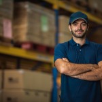 Male warehouse worker portrait in warehouse storage